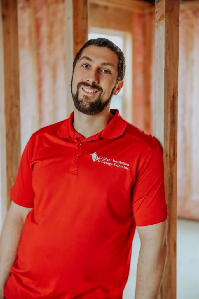 Person leaning on 2x4 while posing for a picture